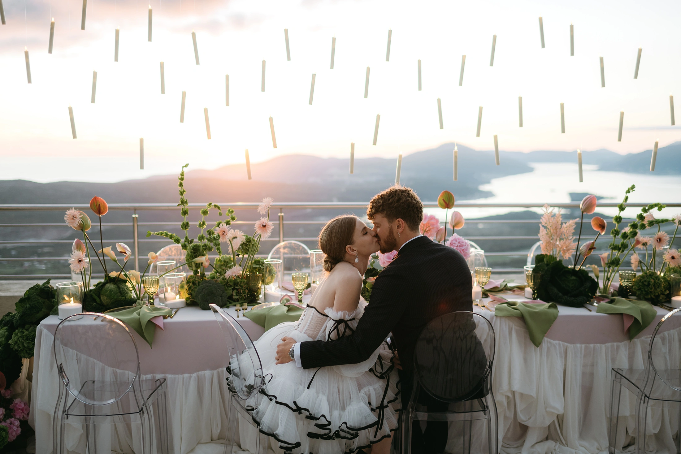 Flottie The Cabbage Affair wedding decor and organisation: elegant outdoor wedding banquet table styled with delicate pink hydrangeas, cabbage leaves, and a magical array of floating candles suspended from above