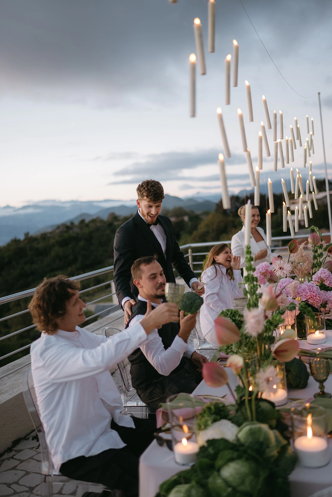 Flottie The Cabbage Affair wedding decor and organisation: elegant outdoor wedding banquet table styled with delicate pink hydrangeas, cabbage leaves, and a magical array of floating candles suspended from above